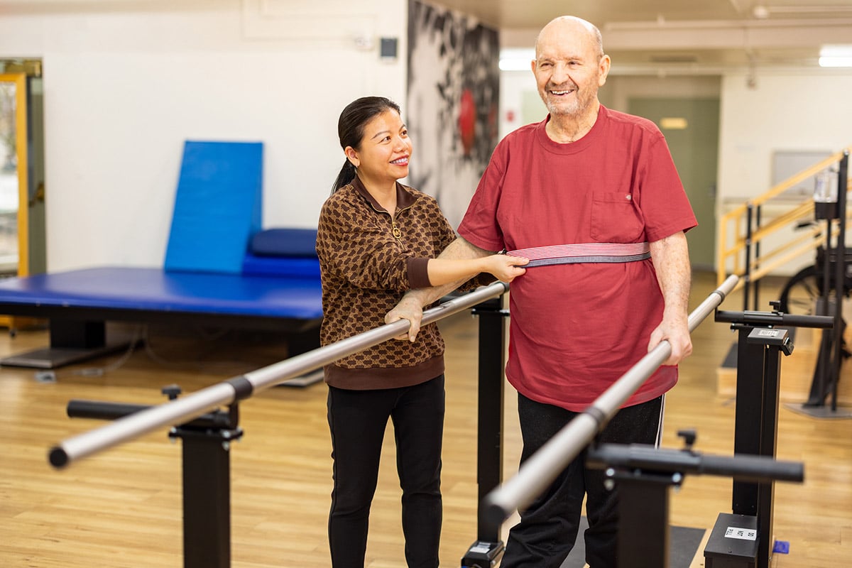 Physical therapist helping patient balance at Orchard View Post Acute